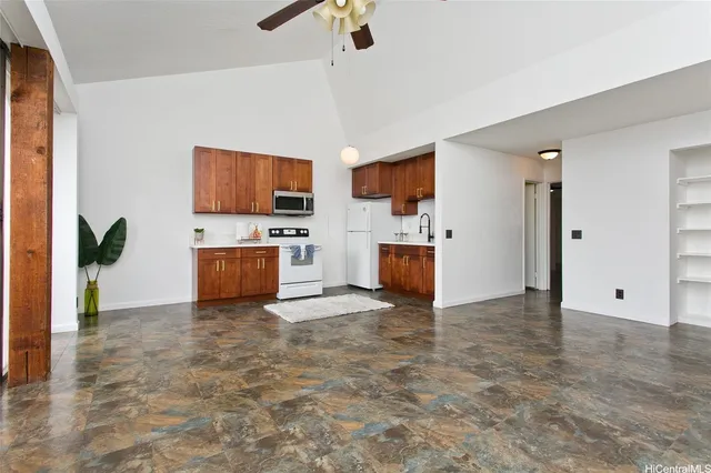 a view of kitchen with furniture and a refrigerator