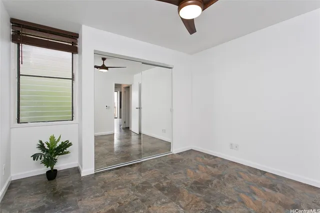 an empty room with potted plants