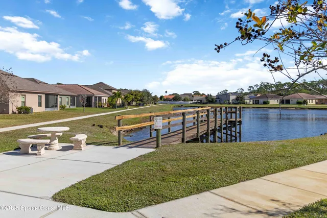 a view of a house with yard and patio