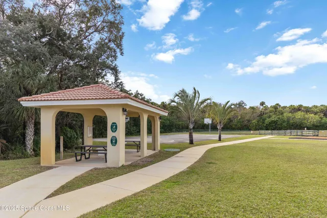 a view of a swimming pool with a lounge chair