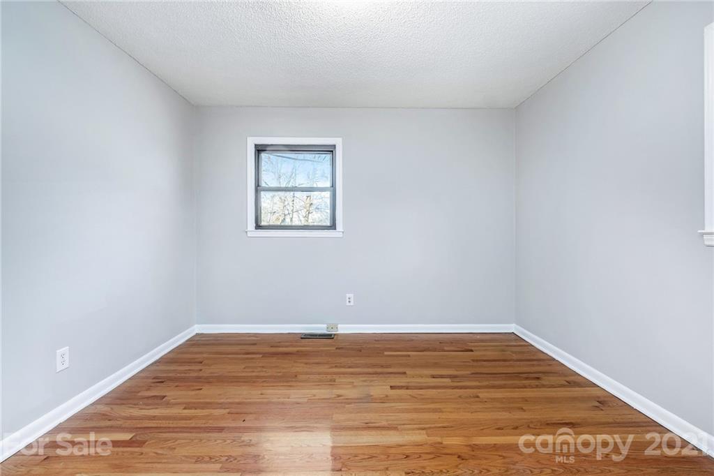 135 Eller Road Gastonia, NC 28056 - Photo 11 of 17 a view of a room with wooden floor and white walls