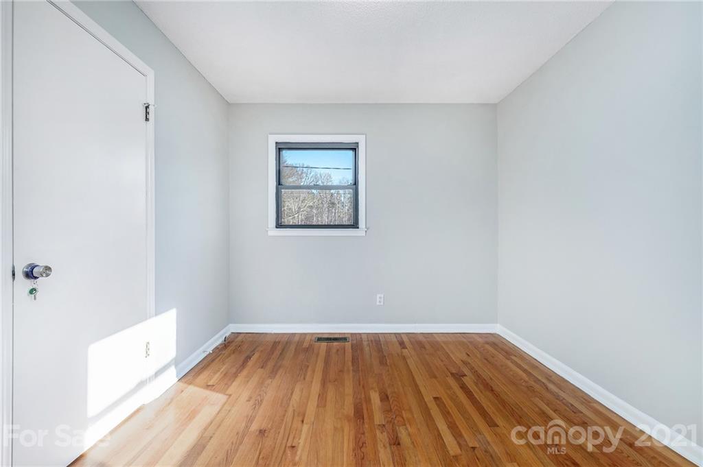 135 Eller Road Gastonia, NC 28056 - Photo 14 of 17 a view of a room with wooden floor and a bathroom