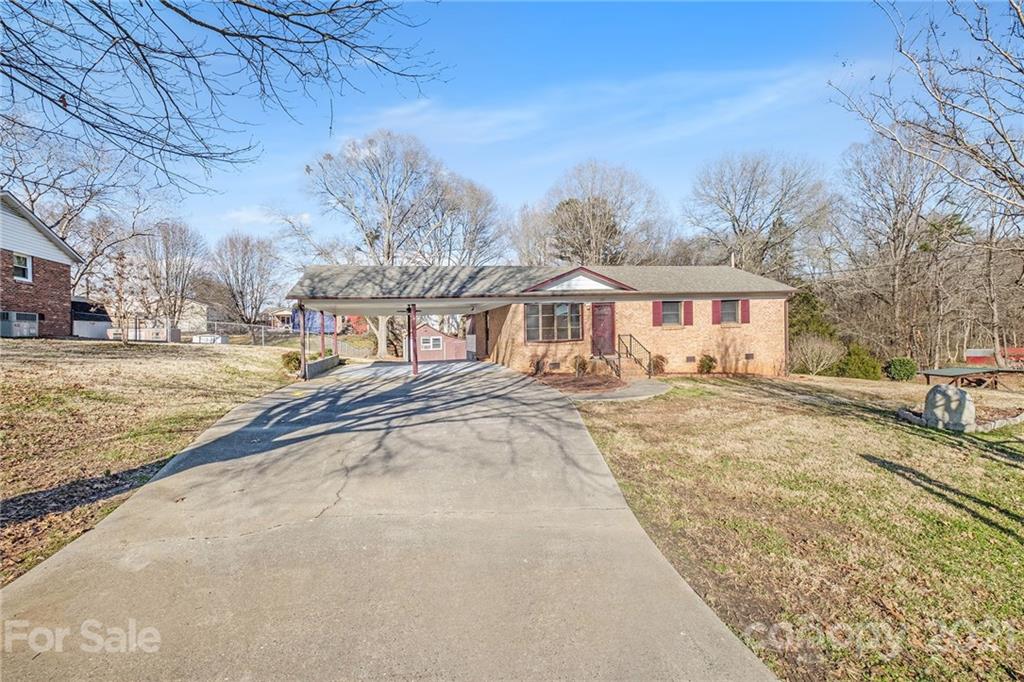 135 Eller Road Gastonia, NC 28056 - Photo 16 of 17 a view of a yard with a house