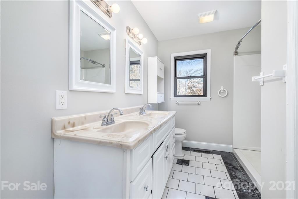 135 Eller Road Gastonia, NC 28056 - Photo 4 of 17 a bathroom with a sink and a mirror