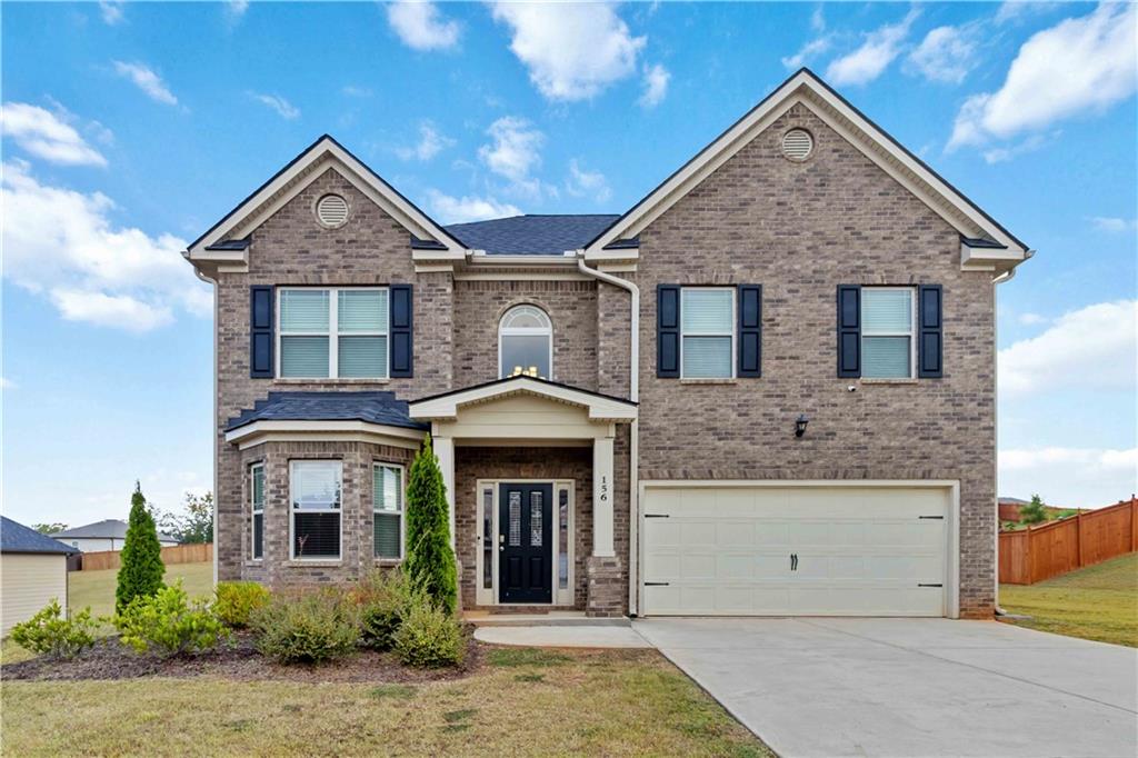 156 Beaumont Way Hampton, GA 30228 - Photo 1 of 21 front view of a house