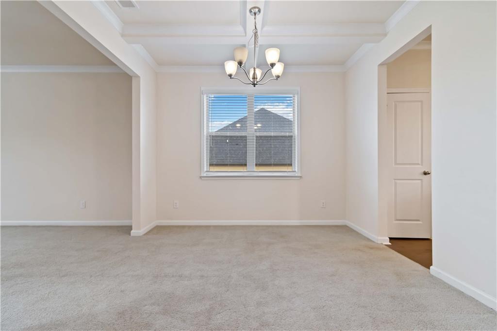 156 Beaumont Way Hampton, GA 30228 - Photo 5 of 21 a view of an empty room with window