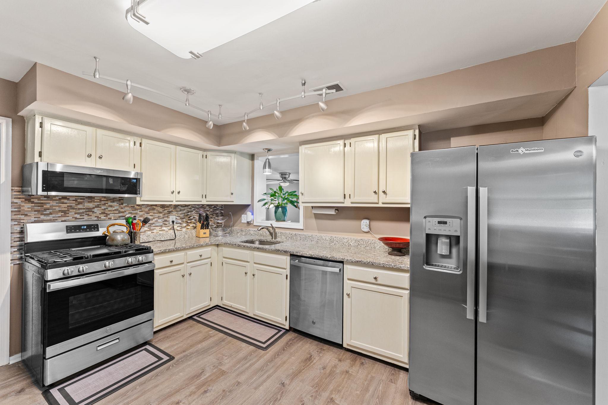 182 Wagon Wheel Road Norristown, PA 19403 - Photo 15 of 44 a kitchen with a sink stainless steel appliances and cabinets
