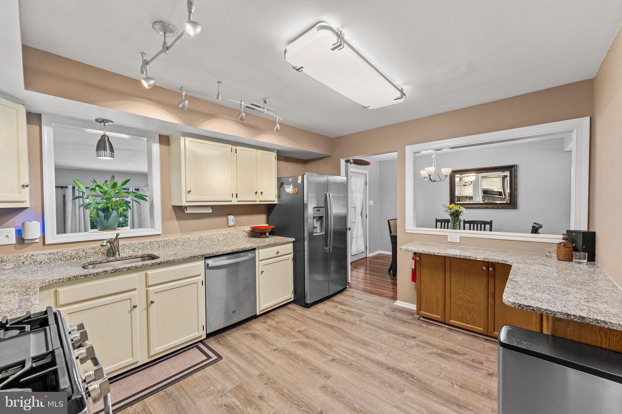 182 Wagon Wheel Road Norristown, PA 19403 - Photo 17 of 44 a large kitchen with kitchen island a sink dishwasher a stove a refrigerator with island and chairs
