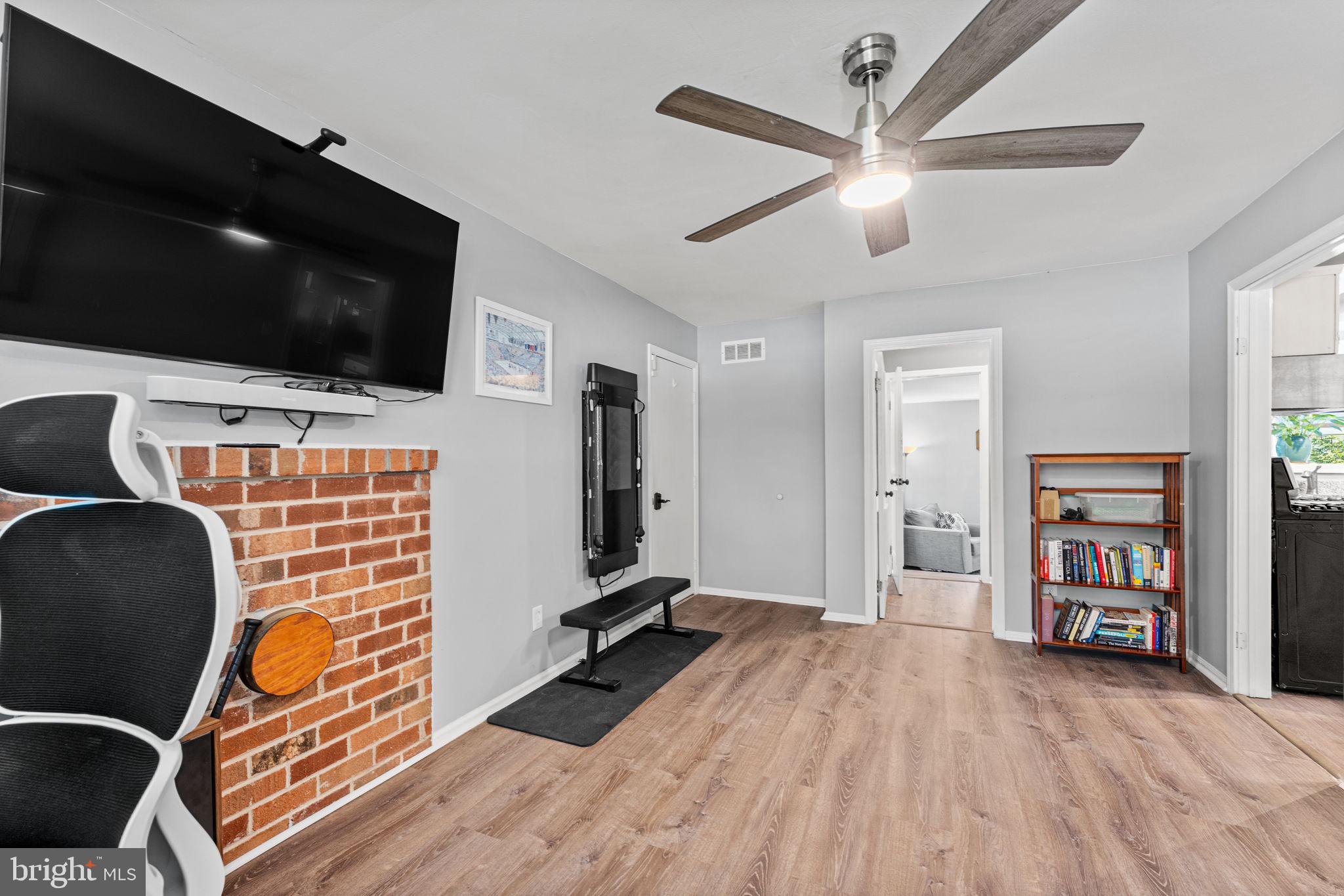 182 Wagon Wheel Road Norristown, PA 19403 - Photo 24 of 44 a view of a livingroom with workspace and a flat screen tv