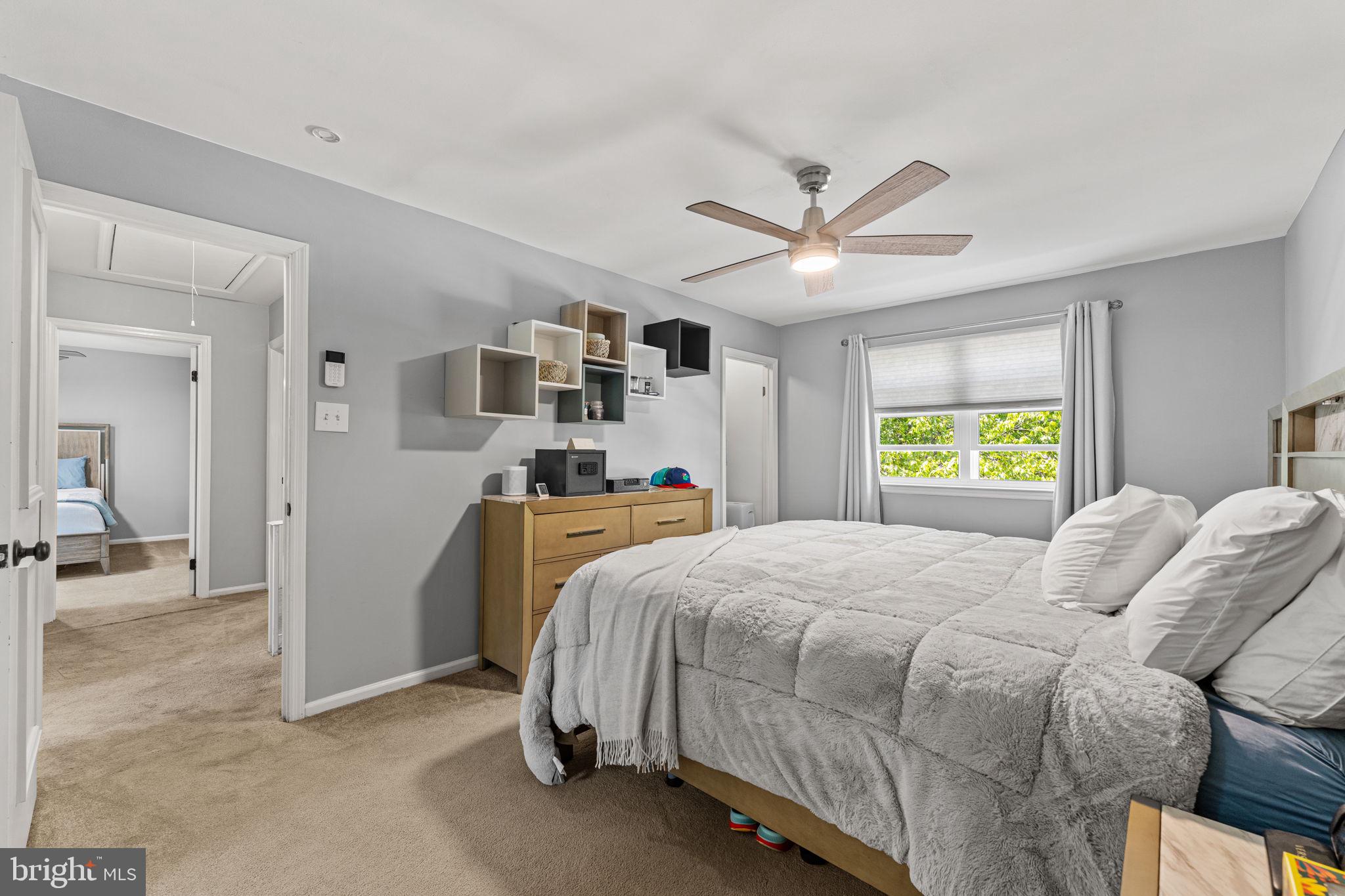 182 Wagon Wheel Road Norristown, PA 19403 - Photo 27 of 44 a bedroom with a bed and a chandelier