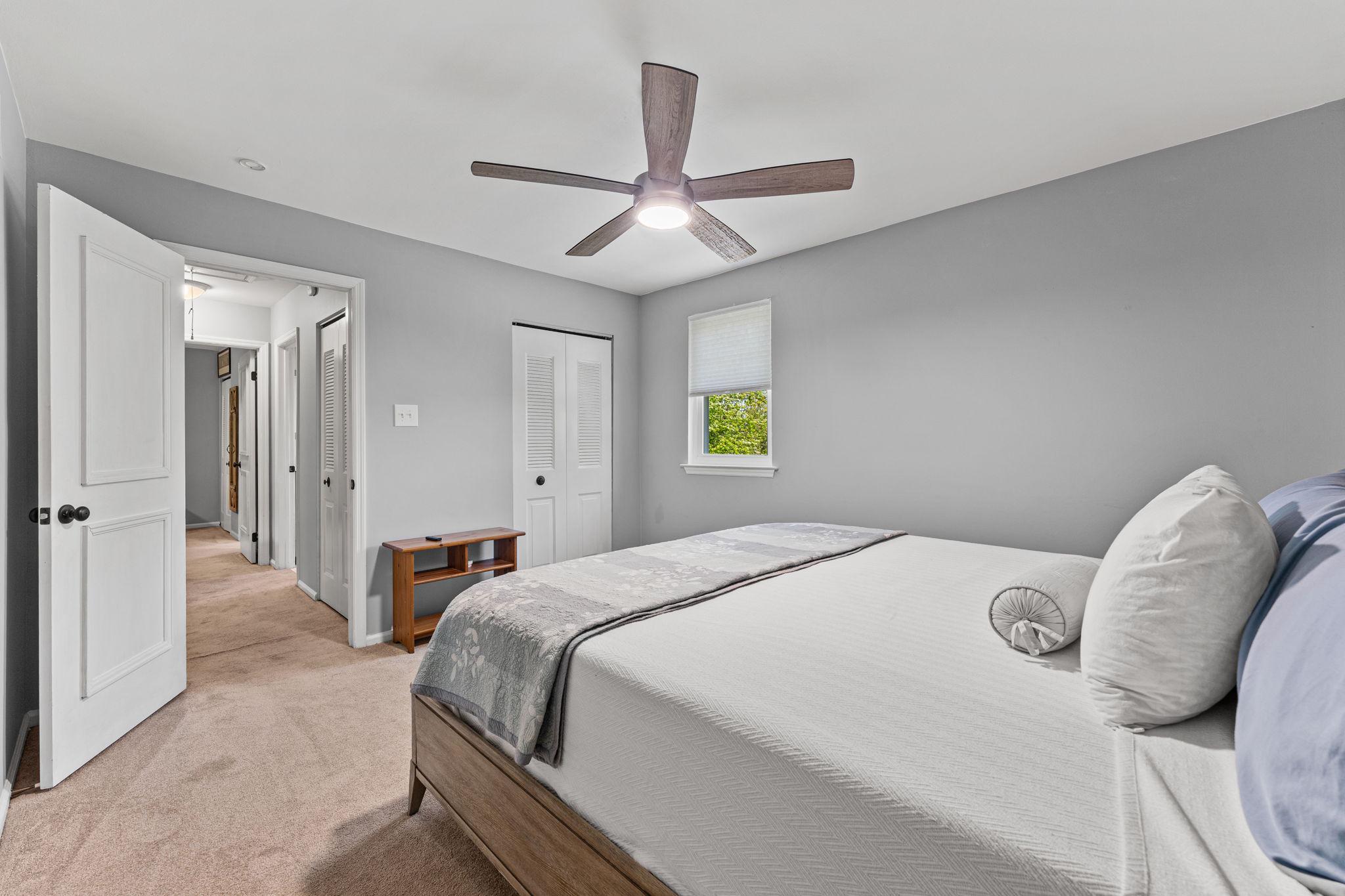 182 Wagon Wheel Road Norristown, PA 19403 - Photo 35 of 44 a bedroom with a bed and a chandelier