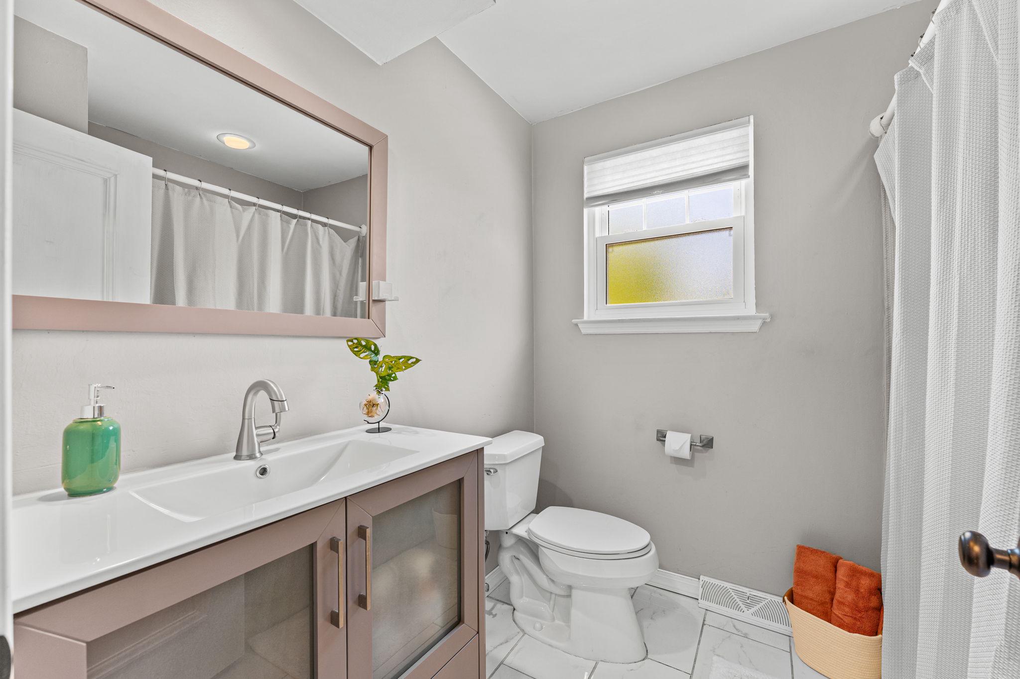 182 Wagon Wheel Road Norristown, PA 19403 - Photo 36 of 44 a bathroom with a granite countertop toilet sink and mirror