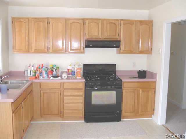 9460 Little Elam Road Charles City, VA 23030 - Photo 3 of 8 a kitchen with stainless steel appliances granite countertop a refrigerator stove and sink