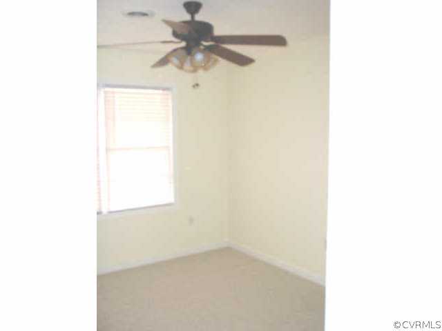 9460 Little Elam Road Charles City, VA 23030 - Photo 6 of 8 a view of an empty room with a window