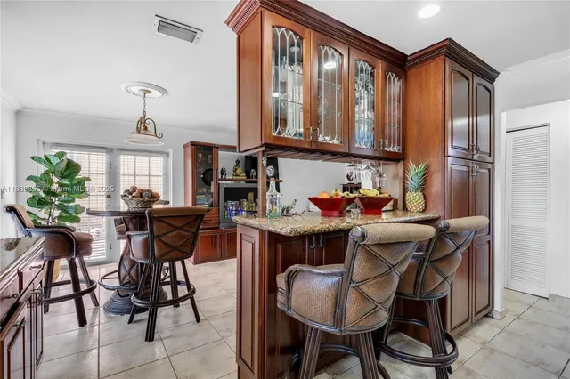 a dining room with furniture and a window