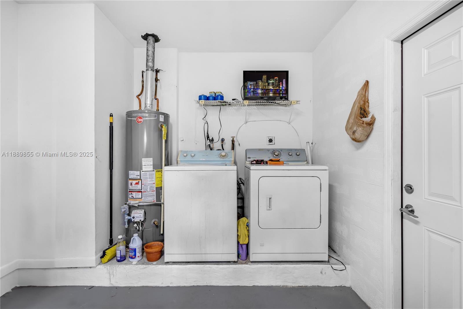 10213 Southwest 156th Avenue Miami, FL 33196 - Photo 16 of 29 a utility room with dryer and washer