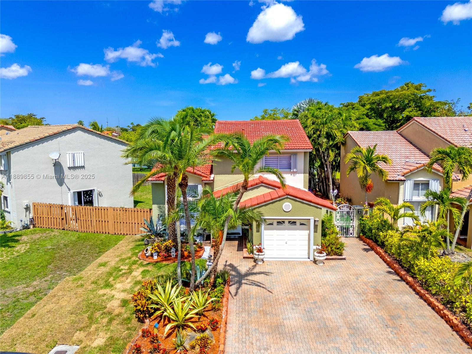 10213 Southwest 156th Avenue Miami, FL 33196 - Photo 2 of 29 a view of house with outdoor space and swimming pool