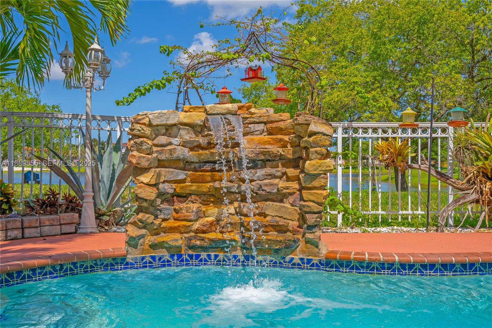 10213 Southwest 156th Avenue Miami, FL 33196 - Photo 21 of 29 a view of swimming pool with a garden