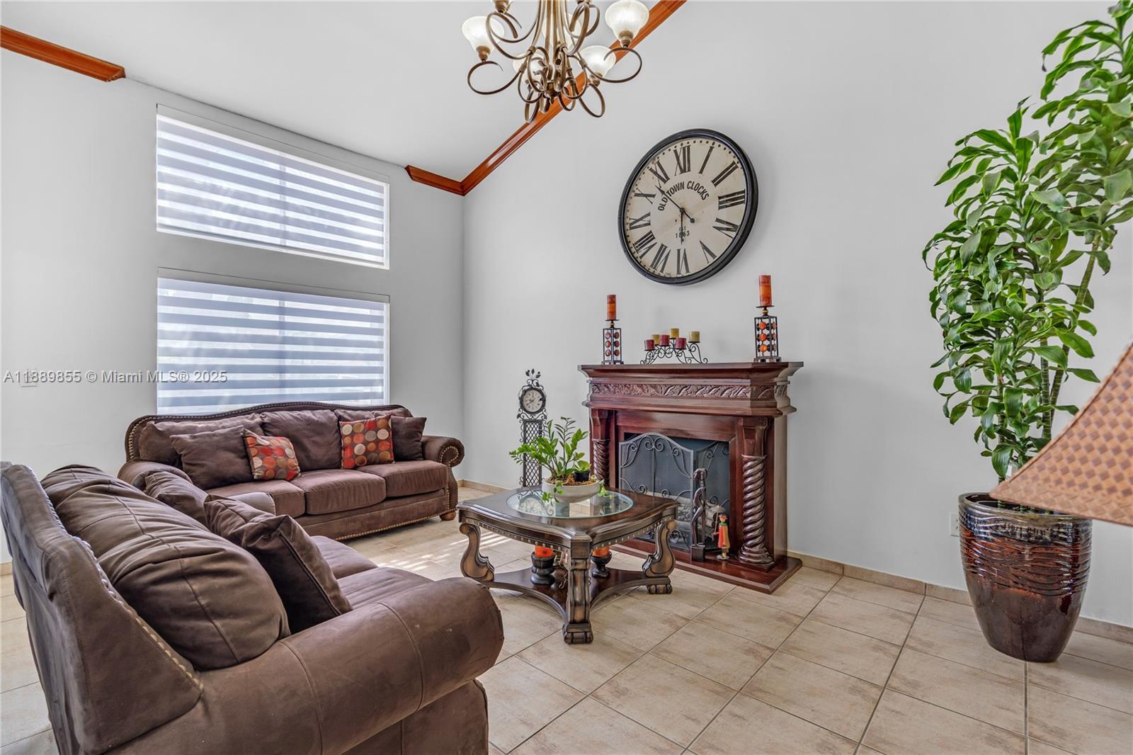 10213 Southwest 156th Avenue Miami, FL 33196 - Photo 5 of 29 a living room with furniture a clock and a window