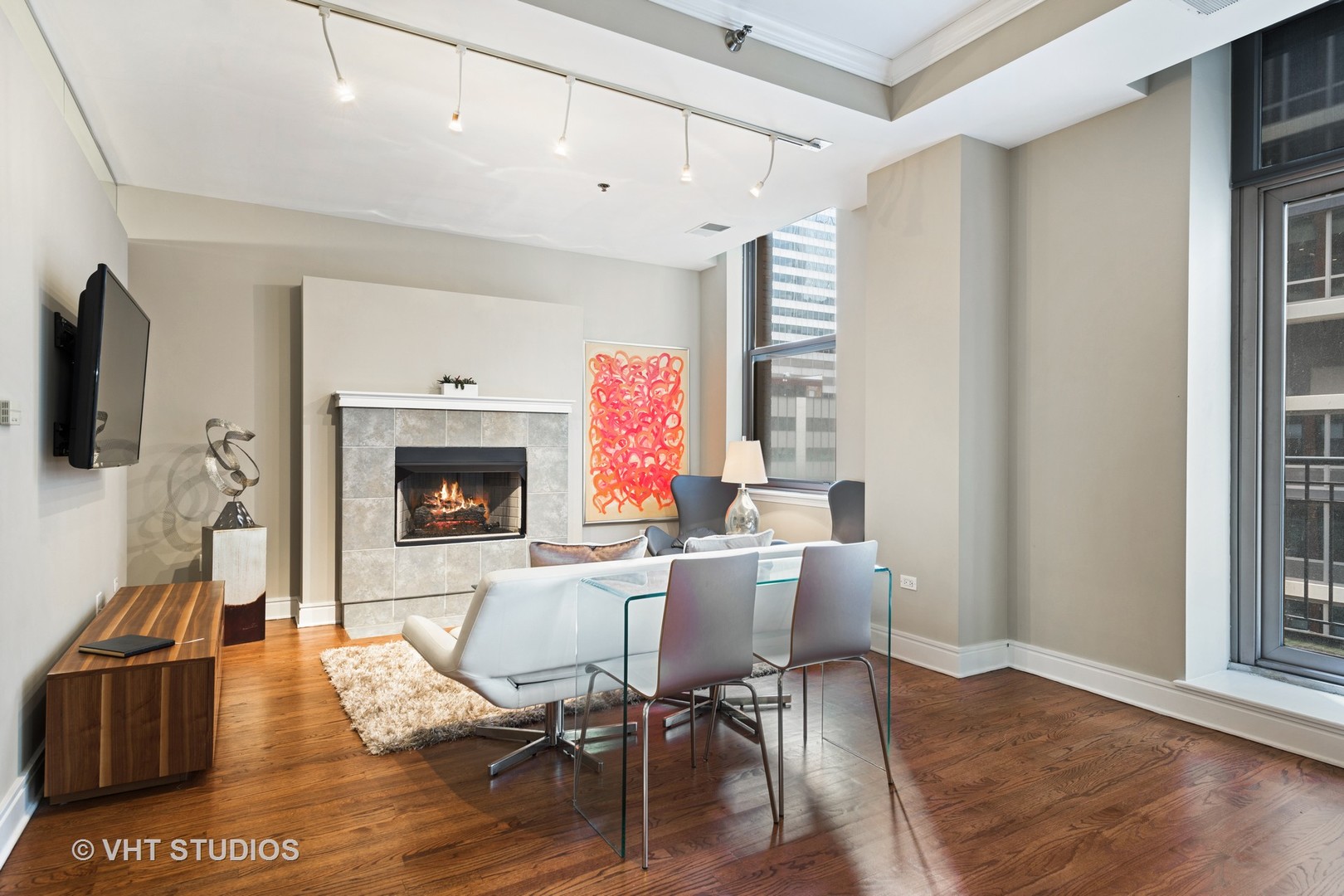 212 West Washington Street, Unit 1002 Chicago, IL 60606 - Photo 2 of 12 a view of a dining room with furniture window and wooden floor