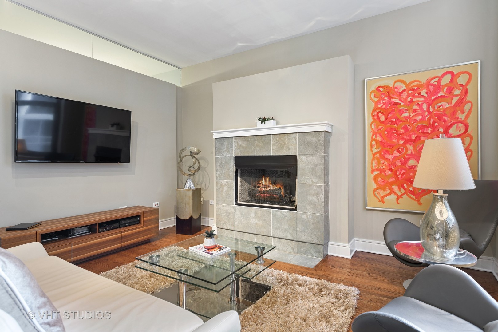212 West Washington Street, Unit 1002 Chicago, IL 60606 - Photo 3 of 12 a living room with furniture and a flat screen tv
