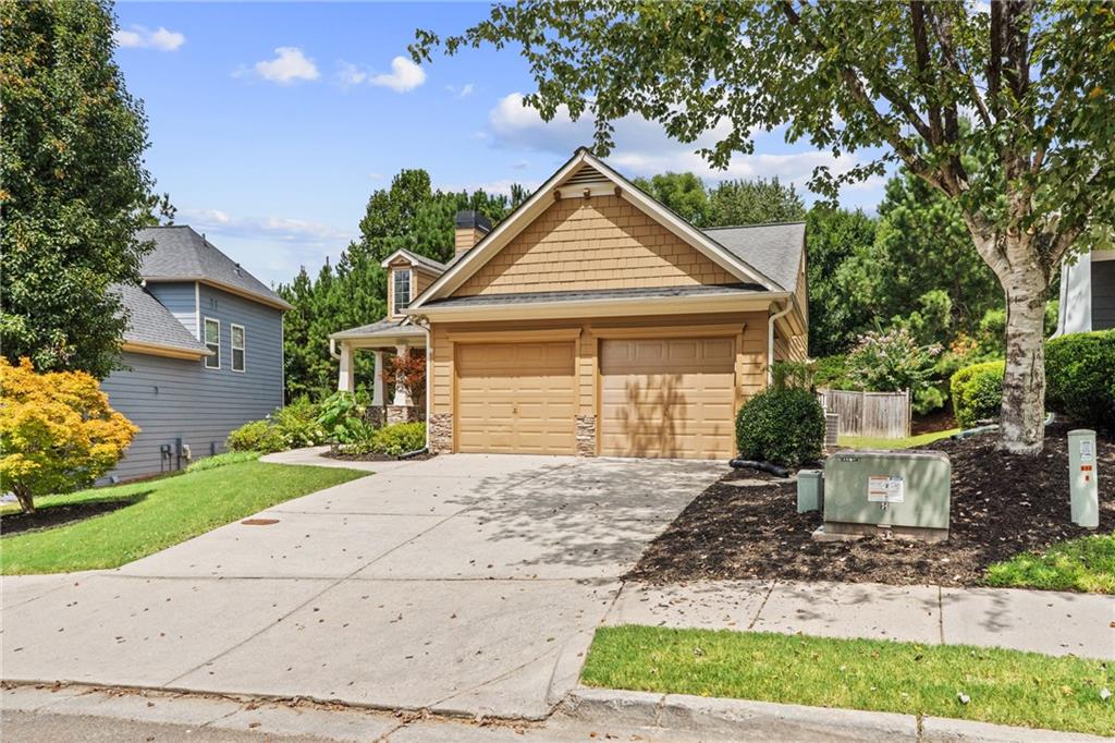 422 Arrowhead Trail Canton, GA 30114 - Photo 2 of 51 a front view of a house with a yard and potted plants