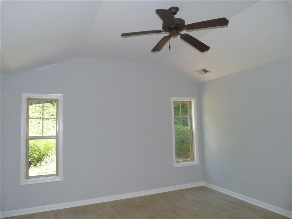422 Arrowhead Trail Canton, GA 30114 - Photo 25 of 51 a view of room with a window and a ceiling fan