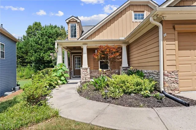 a front view of a house with garden