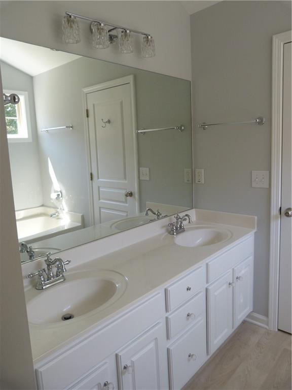 422 Arrowhead Trail Canton, GA 30114 - Photo 36 of 51 a bathroom with a sink and a mirror