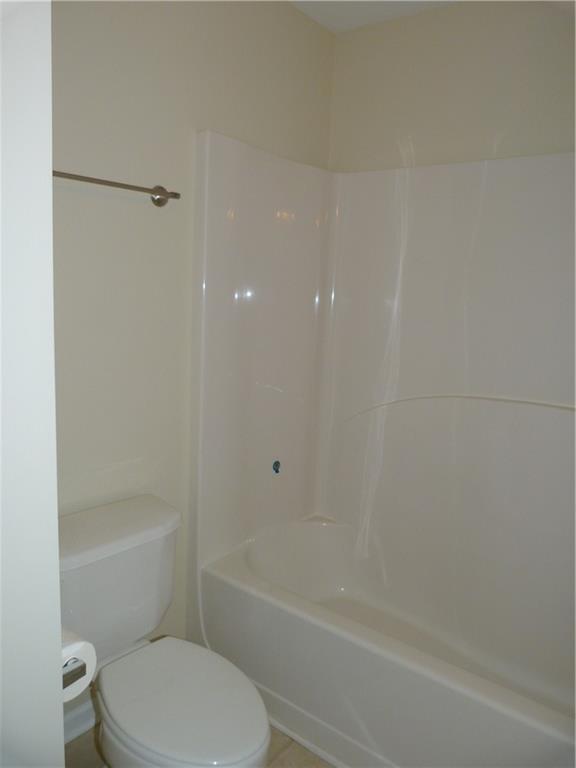 422 Arrowhead Trail Canton, GA 30114 - Photo 43 of 51 a white toilet and tub sitting next to a bathroom sink