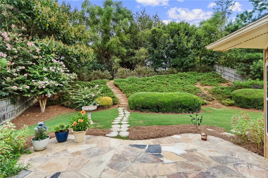 422 Arrowhead Trail Canton, GA 30114 - Photo 46 of 51 a view of a garden with a bench