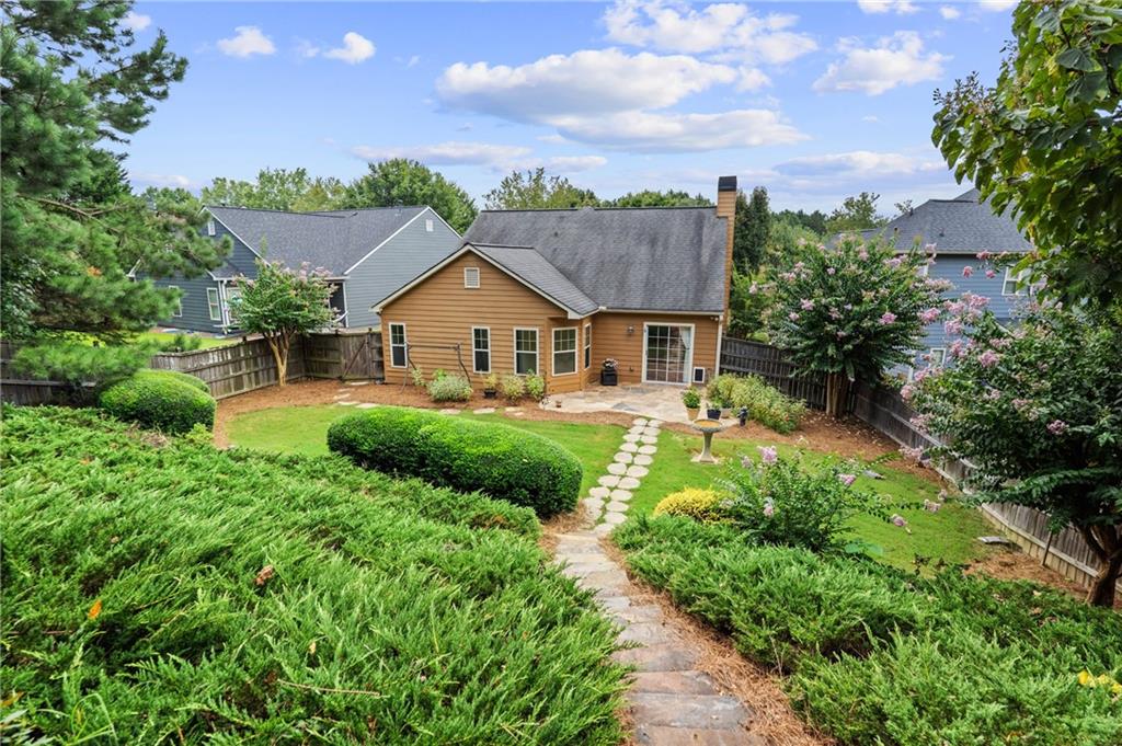 422 Arrowhead Trail Canton, GA 30114 - Photo 49 of 51 a view of a house with a big yard plants and large trees