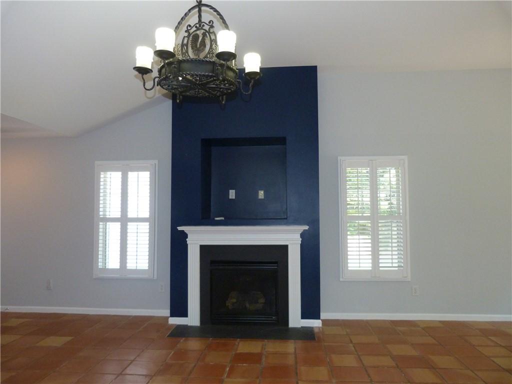 422 Arrowhead Trail Canton, GA 30114 - Photo 6 of 51 a living room with a fireplace windows and a chandelier