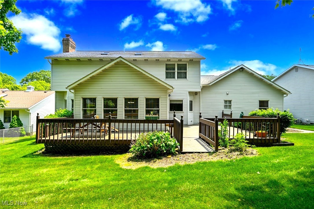 452 Herbert Road Akron, OH 44312 - Photo 3 of 48 *BACK OF THE HOME SHOWING DUAL TIER WRAP AROUND DECK OFF OF SUNROOM! ~