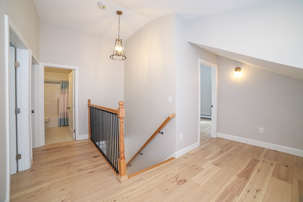 3 Woods Road Westminster, MA 01473 - Photo 28 of 42 a view of a hallway with wooden floor and staircase