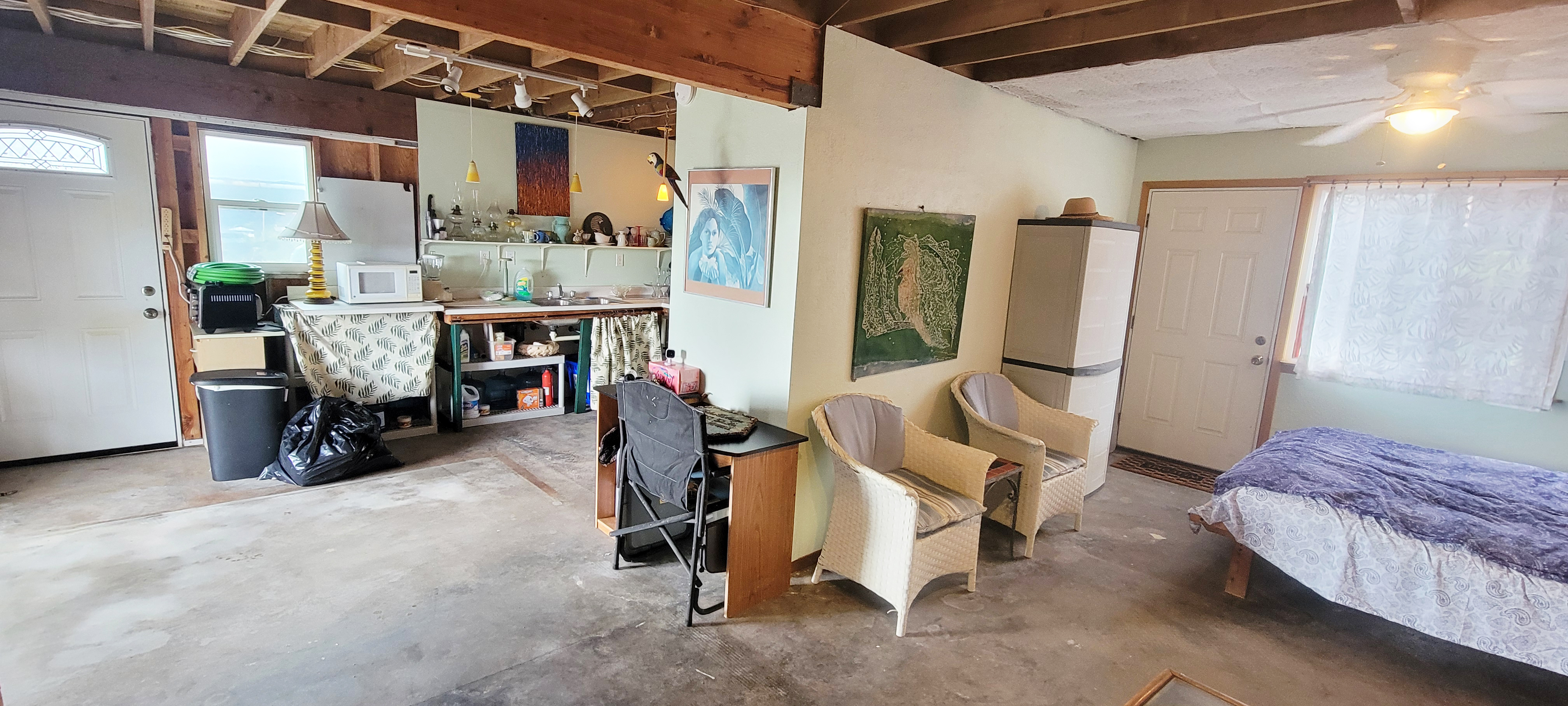 88-1520 Ehiku Avenue Captain Cook, HI 96704 - Photo 15 of 29 a bedroom with furniture and a large window