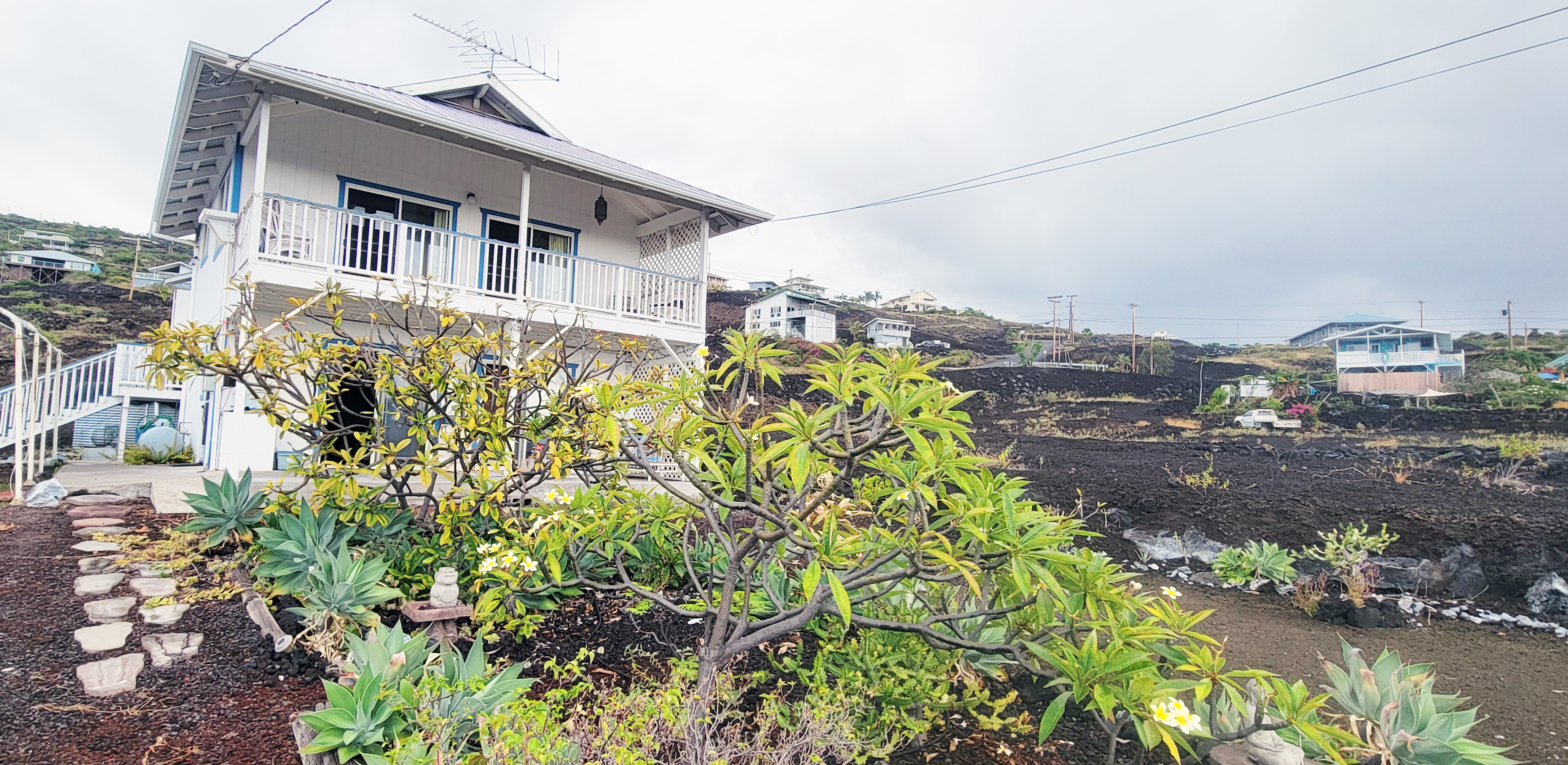 88-1520 Ehiku Avenue Captain Cook, HI 96704 - Photo 3 of 29 a front view of a house with a yard