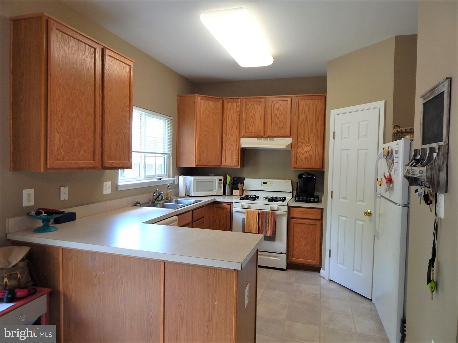 360 Snyder Lane Culpeper, VA 22701 - Photo 6 of 19 a kitchen with a sink a stove and refrigerator