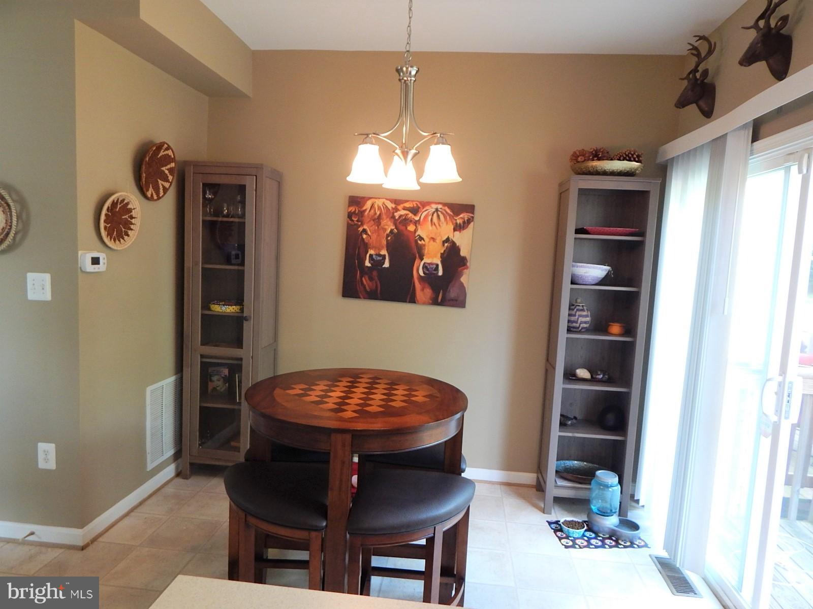 360 Snyder Lane Culpeper, VA 22701 - Photo 8 of 19 a view of a dining room with furniture and chandelier