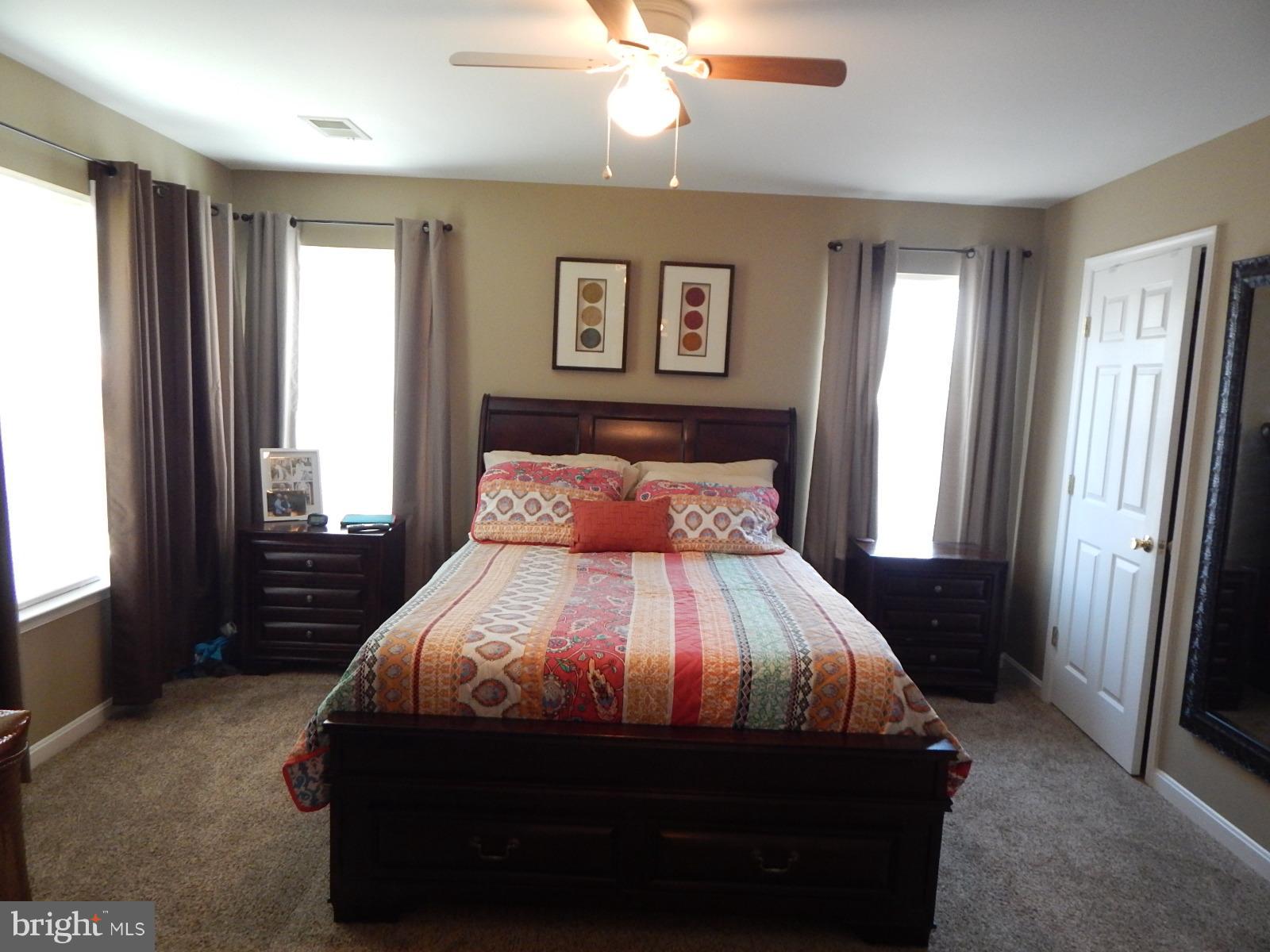 360 Snyder Lane Culpeper, VA 22701 - Photo 9 of 19 a bedroom with a bed and a window