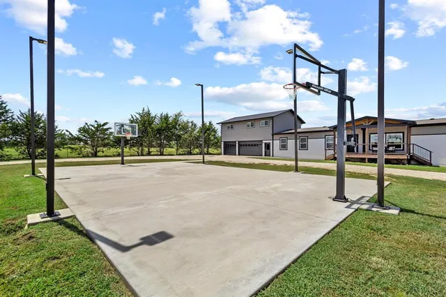 a swimming pool with outdoor seating and yard