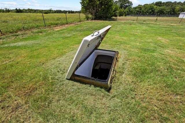 a view of a field with sitting area