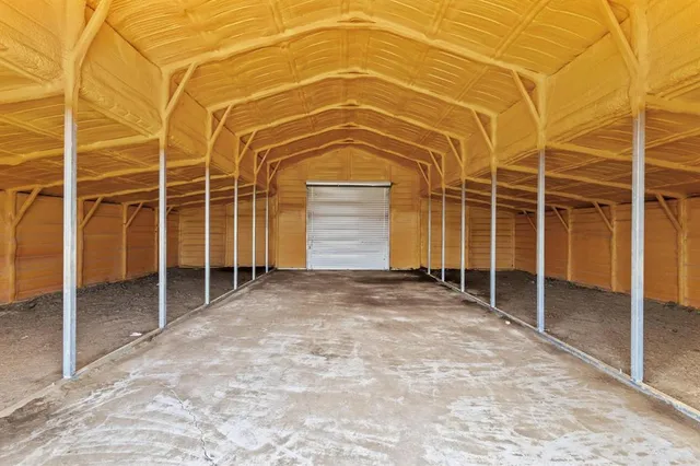 a view of a room with wooden walls