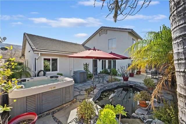 a front view of house with yard outdoor seating and barbeque oven