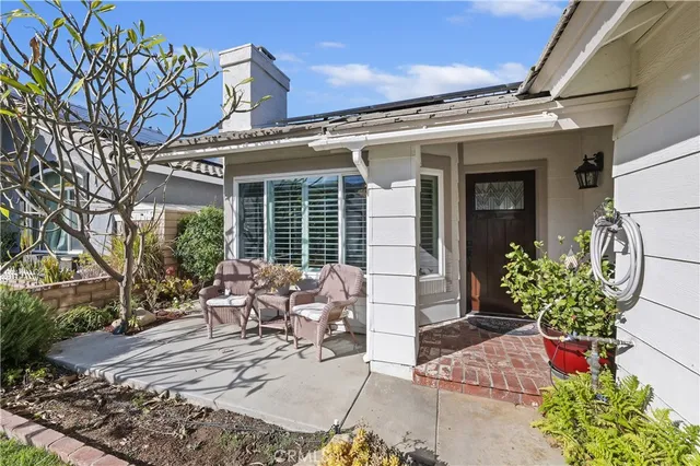 a view of a chairs and table in a patio
