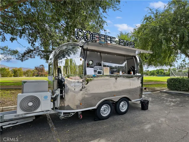 a view of a car in front view of a house