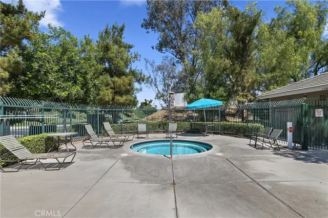 a view of a swimming pool with a patio