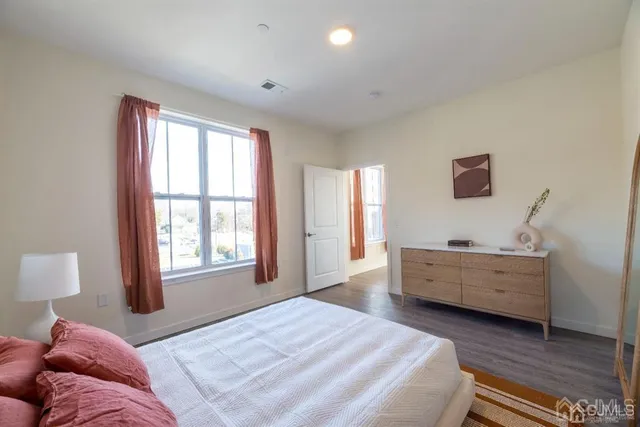 a bathroom with a double vanity sink toilet and a mirror