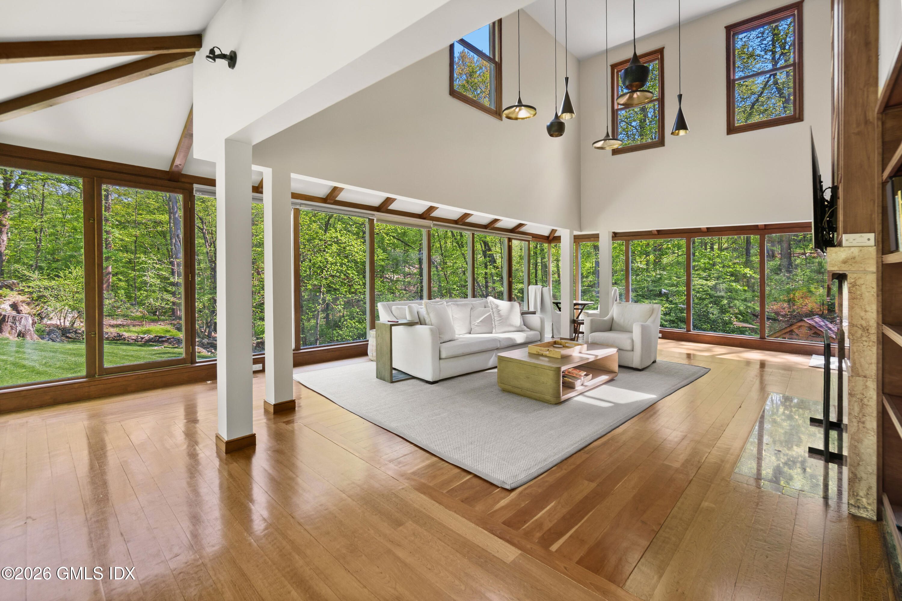 386 Taconic Road Greenwich, CT 06831 - Photo 1 of 22 a living room with furniture and a large window