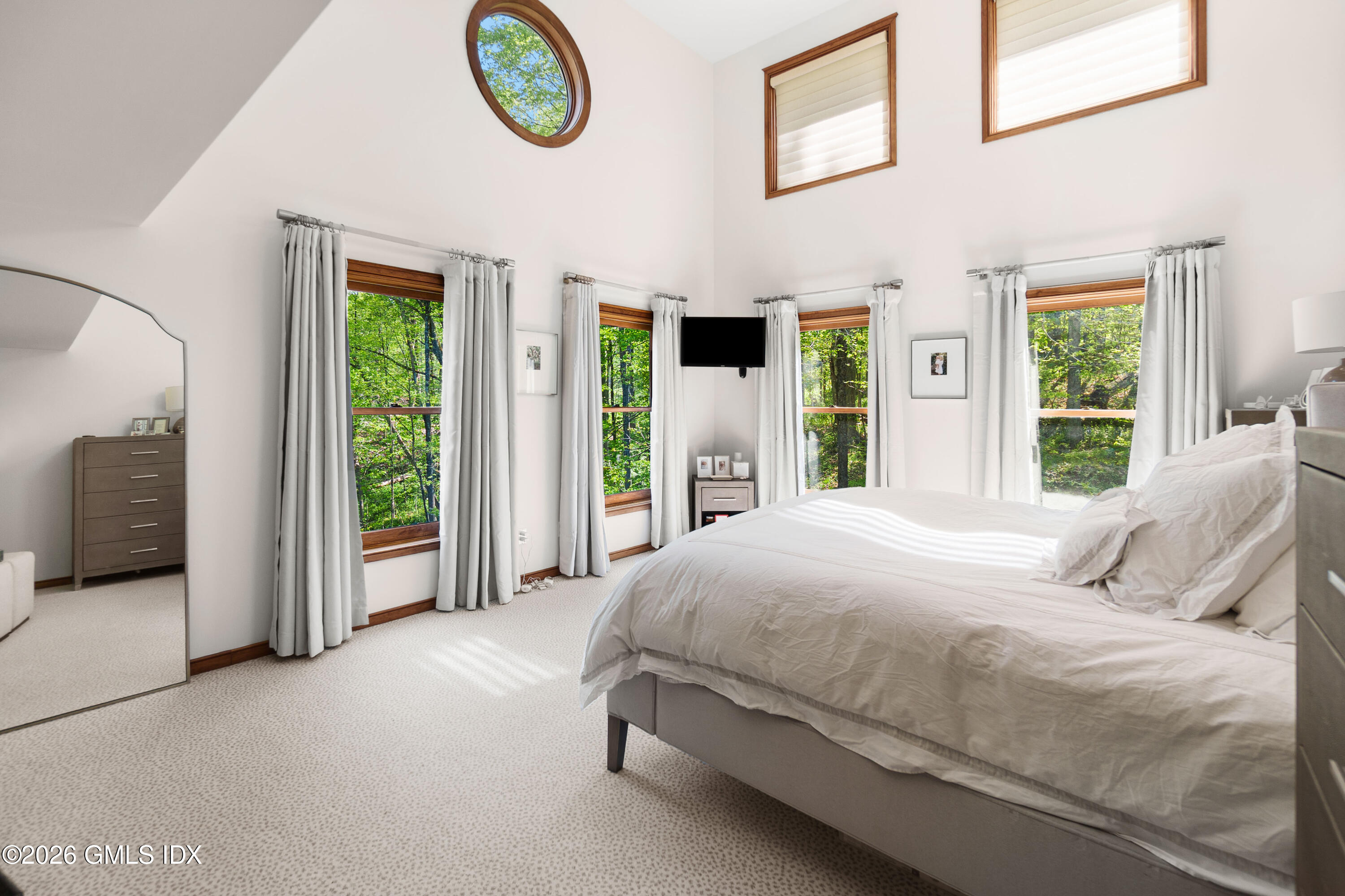 386 Taconic Road Greenwich, CT 06831 - Photo 11 of 22 a bedroom with a bed and a window